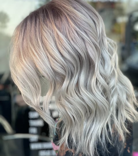 a woman with silver blonde cool ash hair 