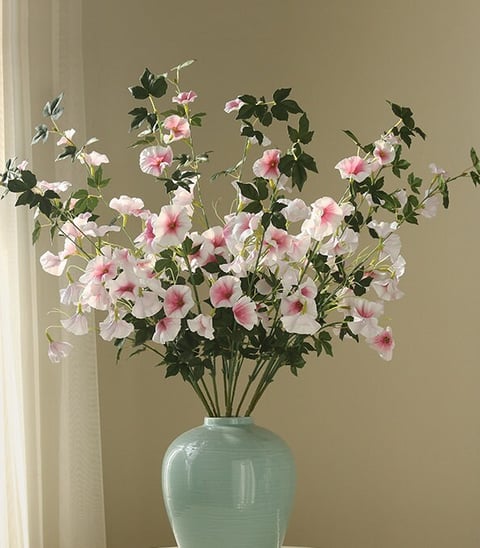 white and pink faux petunias in a vase