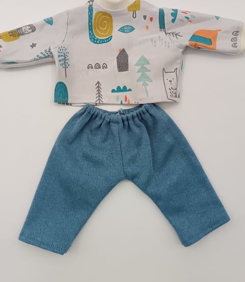 Colourful dolls top with denim blue trousers