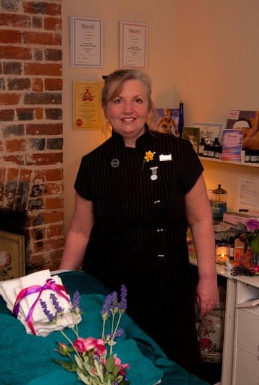 Yvonne in uniform in her Health & Beauty room