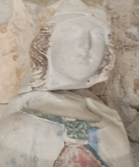 The modified original fourteenth century bust of the Virgin, .