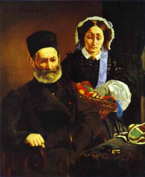 a man and woman sitting on a chair