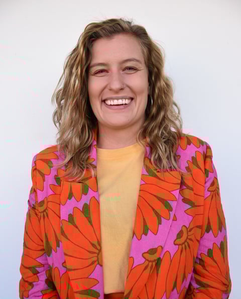 Portrait of psychologist Ingrid wearing a bright blazer