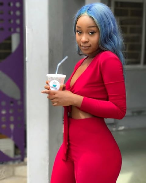 Efia Odo in a stunning red dress.