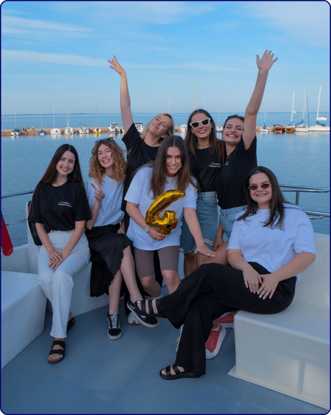 A group of people from Linkedist standing on a boat