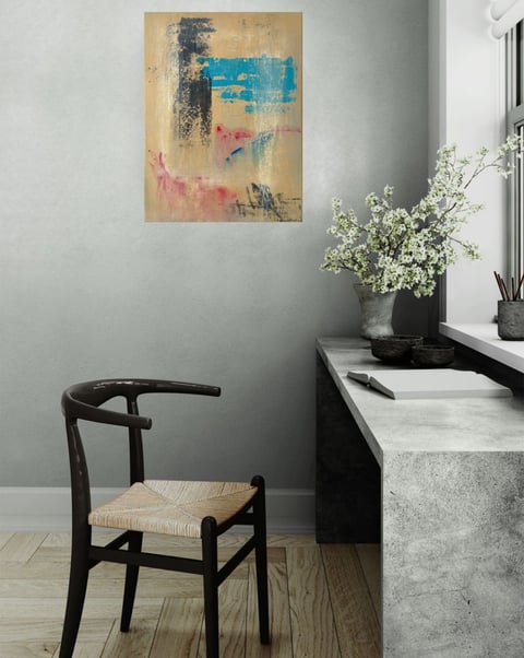 Ochre painting with black and azure marks in room with designer chair