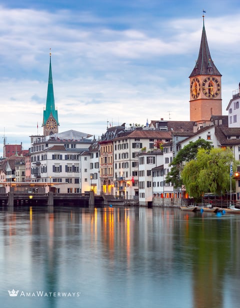 a cityscape of buildings and a clock tower