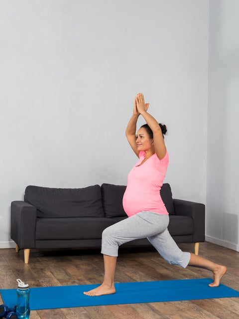 an image of a pregnant women doing yoga