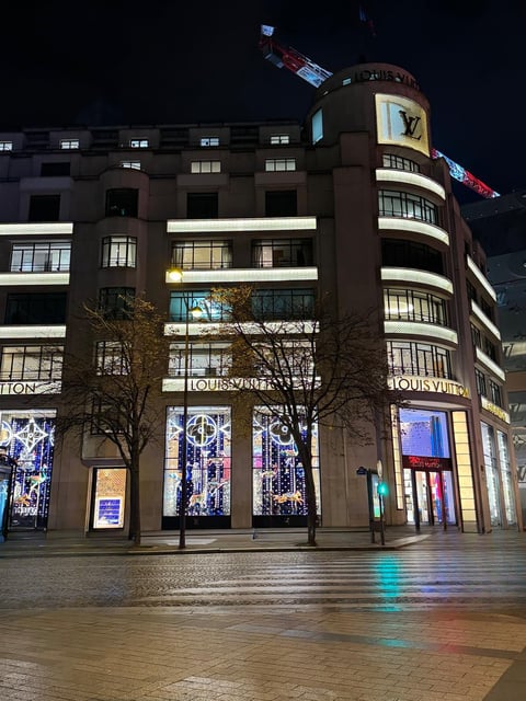 a building with a clock tower in the middle of the street