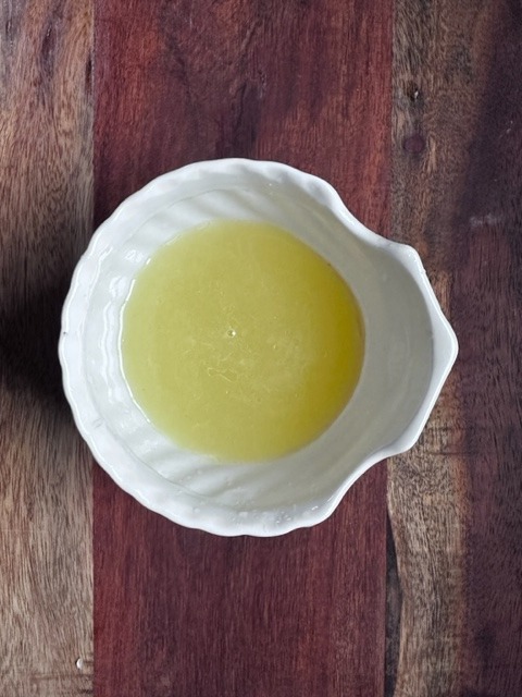 About 1/2 cup of lemon juice 
