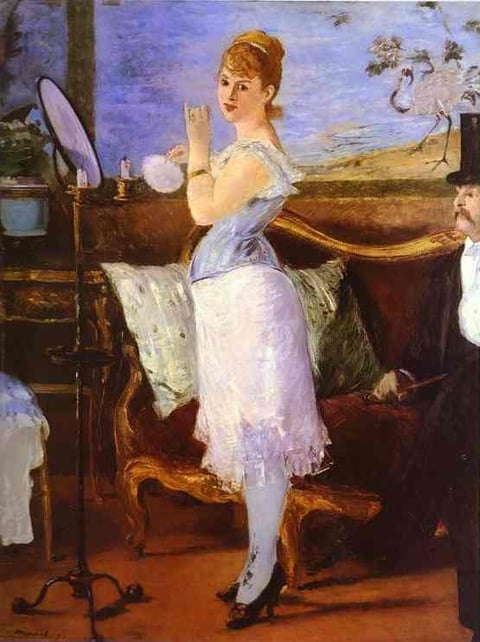 a woman in a white dress and a man in a tuxedo
