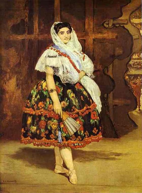 a woman in a dress with a fan