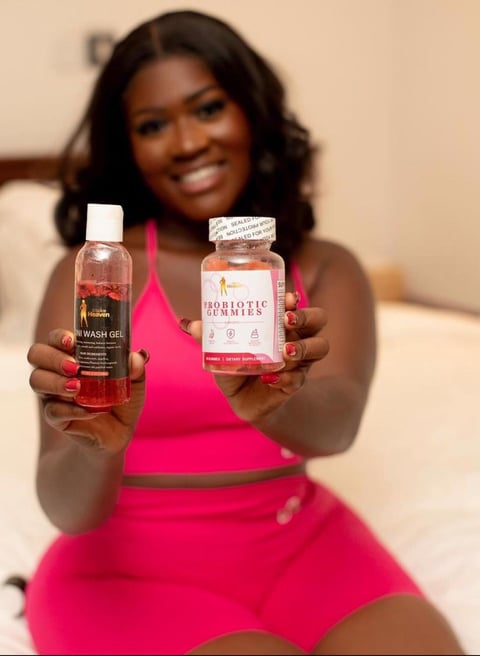 Fella Makafui in a pink top sitting and promoting some of her producta.