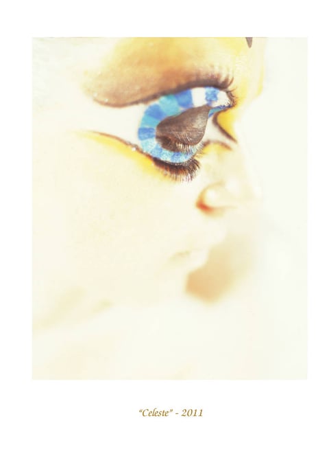 a woman with blue eyeshadow and blue eyeshadow