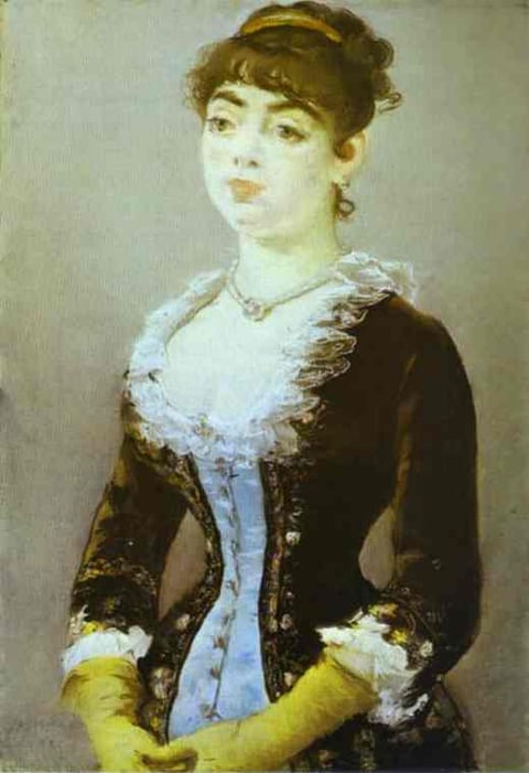 a woman in a black dress with gloves and gloves