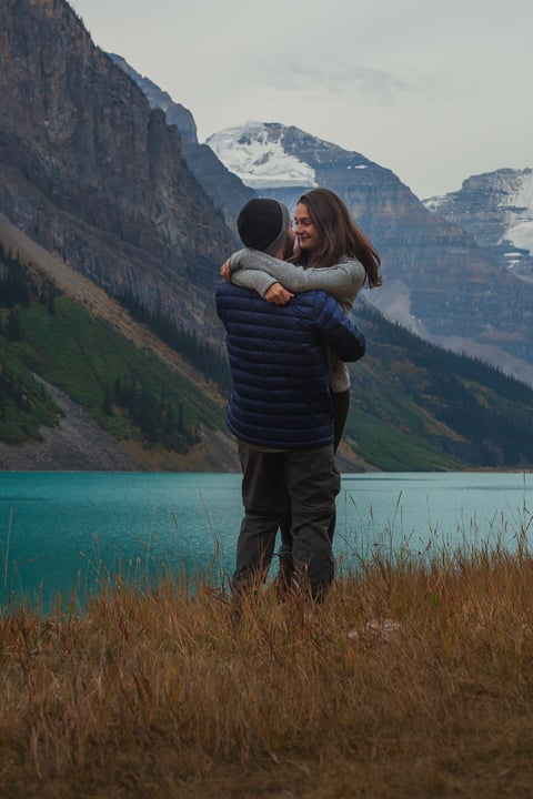 Couple getting engaged at Lake Louise