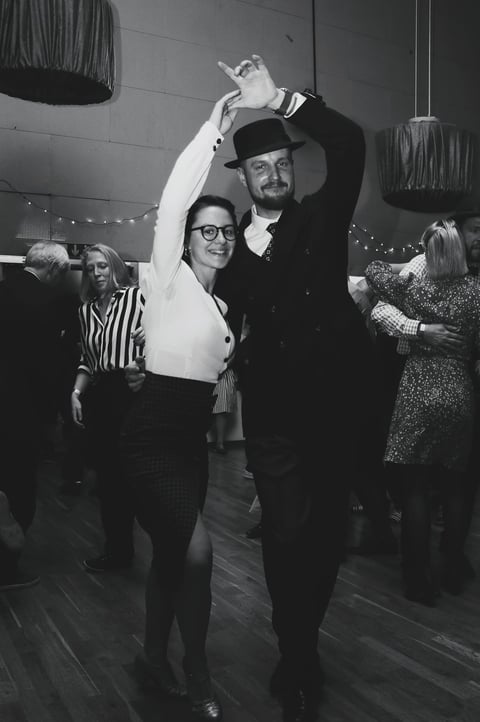 a man and woman dancing at a dance floor