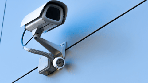 a camera mounted to a wall of a building