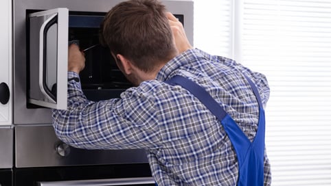 a man in a blue apron and overall overall overall overall overall overall overall overall overall