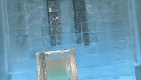 a glass block with a candle in it