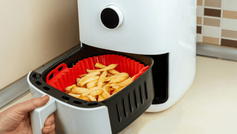 a person is putting food in a container