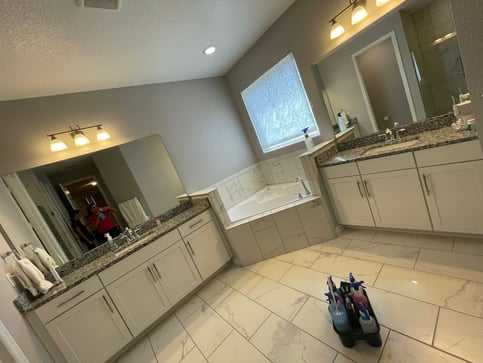 a bathroom with a tub and a sink