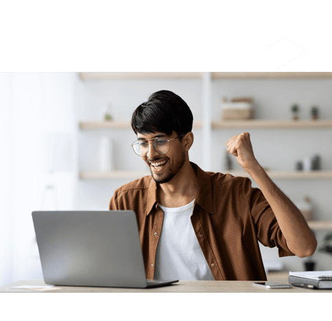 a man wearing glasses being happy looking at his laptop screen representing win in his online business, on blur backdrop.