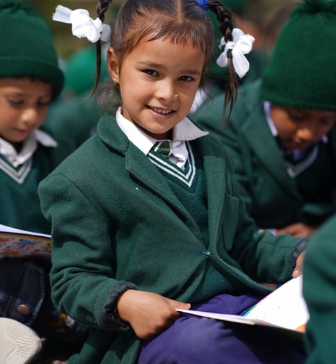 Child sitting with a book in her hands
