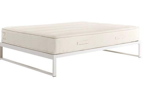 white bedframe with a cream mattress on top