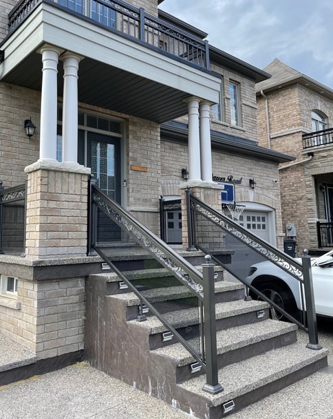 front stairway with grey tinted glass railings