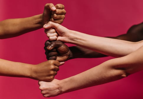 five fists layered on top of each other