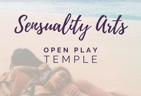 a woman laying on a beach with a woman and woman