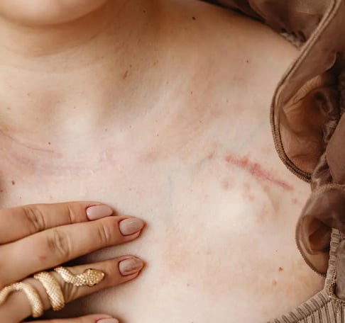a woman with a ring on her chest