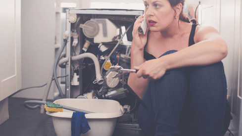 a woman in a black top hat and a white shirt is talking on the phone
