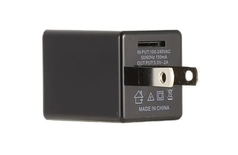 a black and white photo of a usb charger