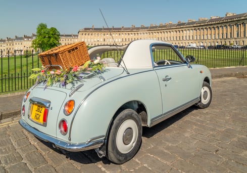 Nissan Figaro classic car with picnic basket