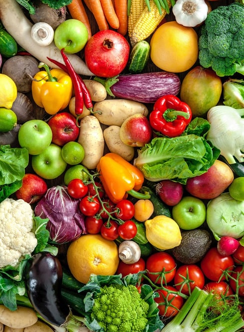 a large assortment of fruits and vegetables in a basket