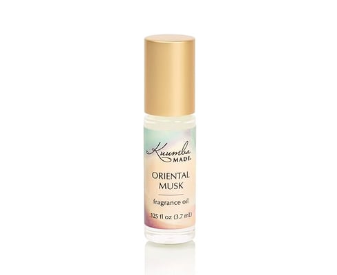 a bottle of oriental musk fragrance oil with a gold cap