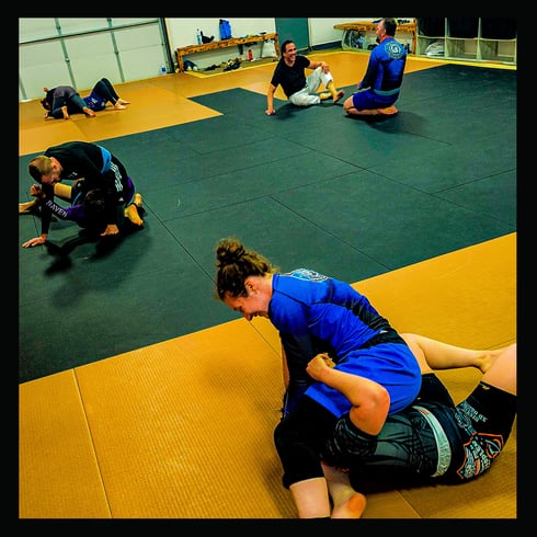 Ice Dragon Academy team members enjoying a No-Gi BJJ rolling session in a positive training environm