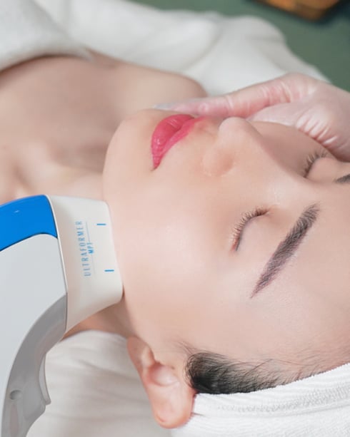 a woman getting a facial lift in a beauty salon