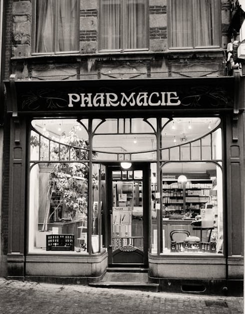 a store front door of a pharmacy shop