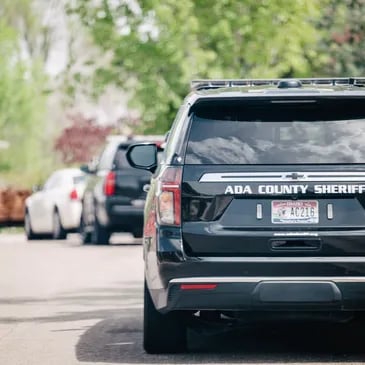 Ada County Sheriff patrol vehicles parked on the side of the road in Boise.