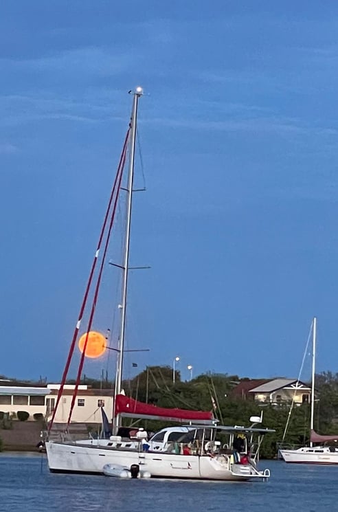 SV Unladen Swallow on anchor under a full moon on the island of Curacou - Fall 2023