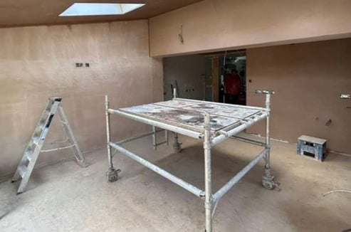 Smooth plaster finish applied to a living room wall by Franklins Plastering in Worcester.