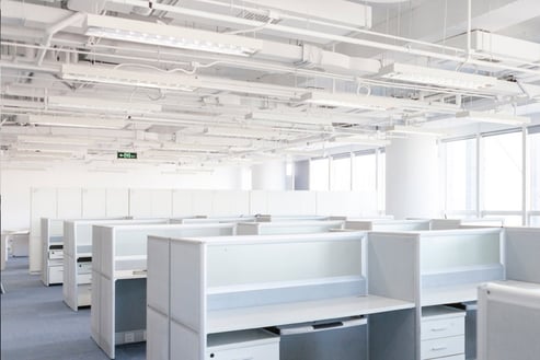 a room with a lot of cubicles and a lot of cubicles