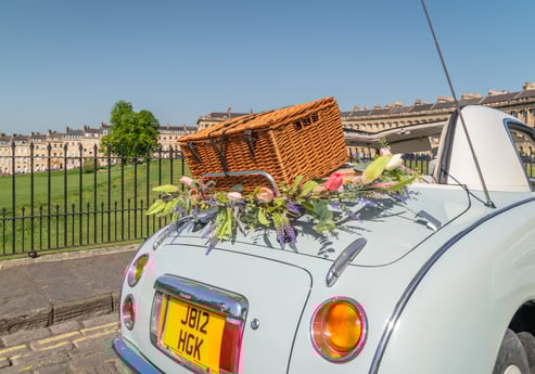 Nissan Figaro classic car with picnic basket