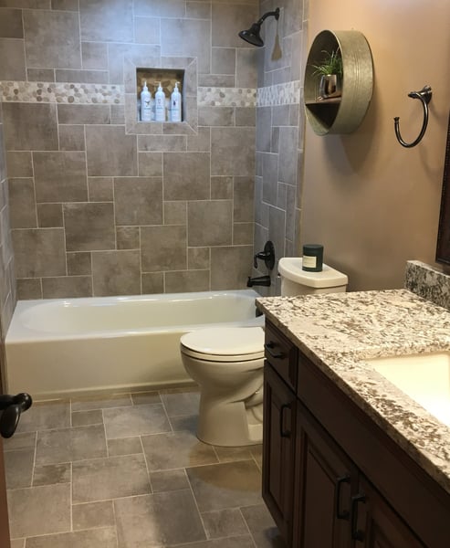 A bathroom with a tub tub and a toilet