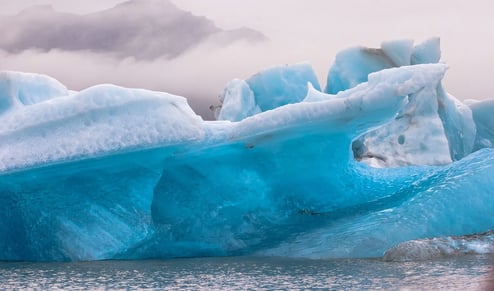 Anchorage, AK -A broken Iceberg floating in the lake at Portage Glacier