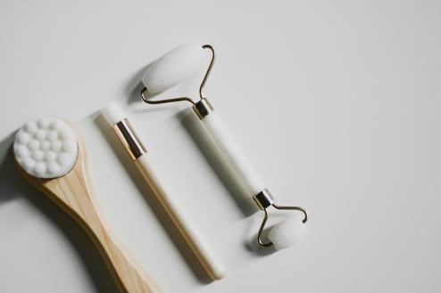 a toothbrush and a toothbrush on a white table
