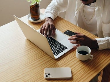 Online Etiquette. Man typing on laptop keyboard.